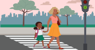 Ibu dan anak menyeberang jalan